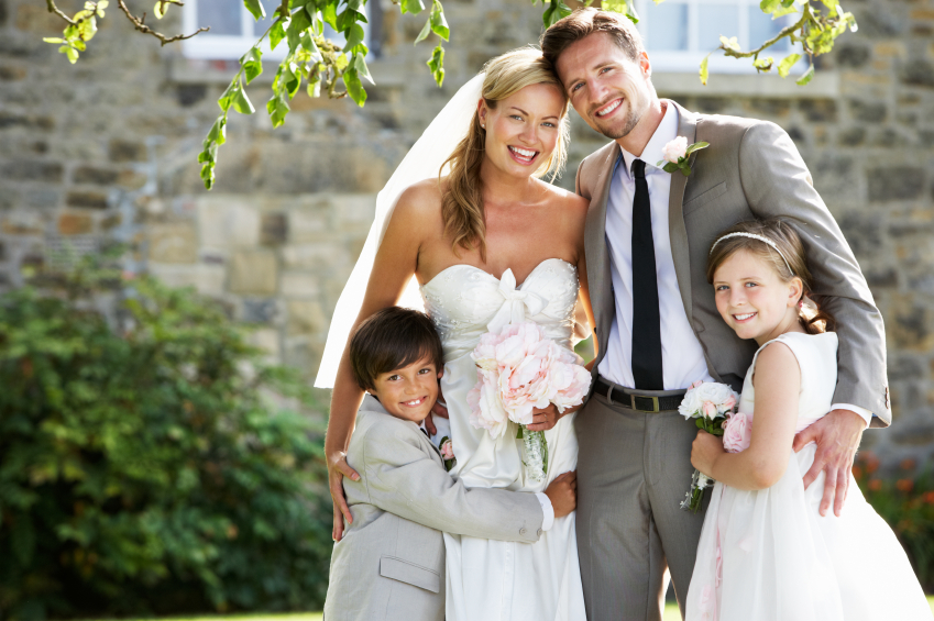 Bride And Groom With Bridesmaid And Page Boy At Wedding